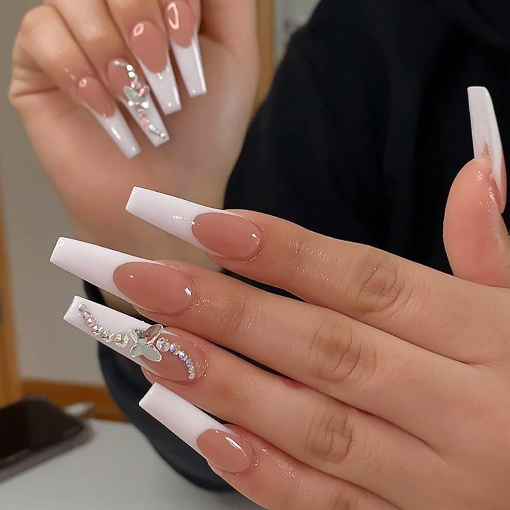 Long acrylic nails with nude polish