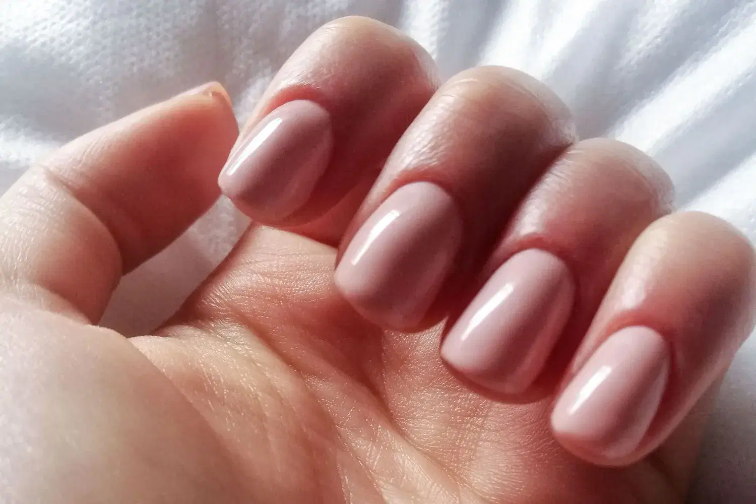 Gel manicure with neutral nude tone