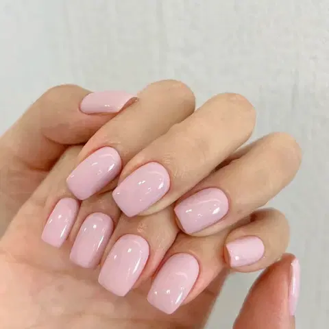 Gel manicure with glossy pink finish